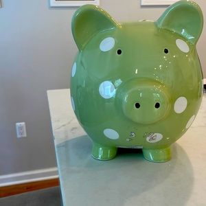 I am selling a green and white piggy bank